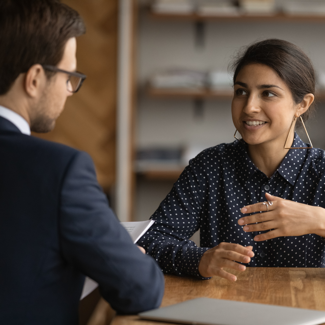 Professional HR consultant discussing career opportunities with a job seeker